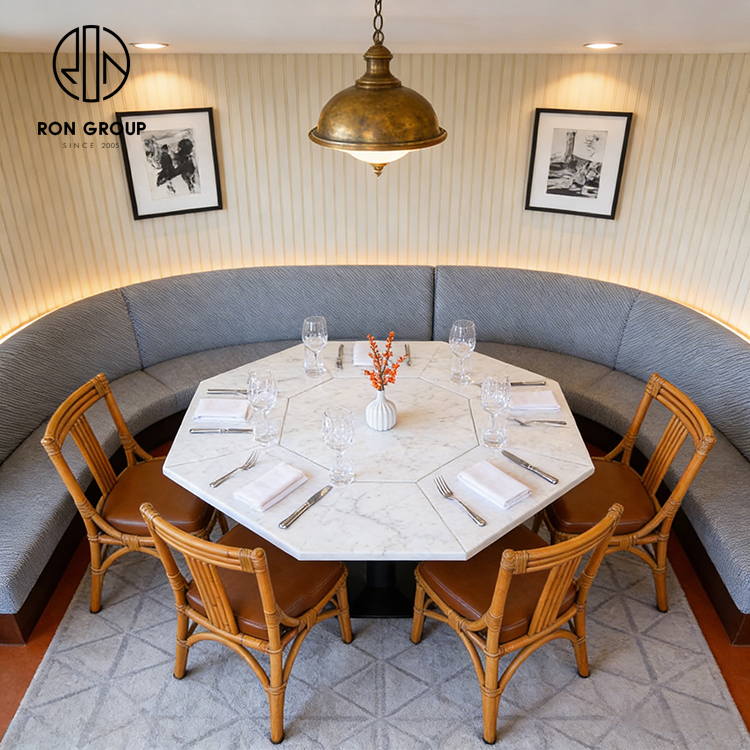 Custom Curved Booth Seating with Octagonal Stone Table for Space-Efficient Dining