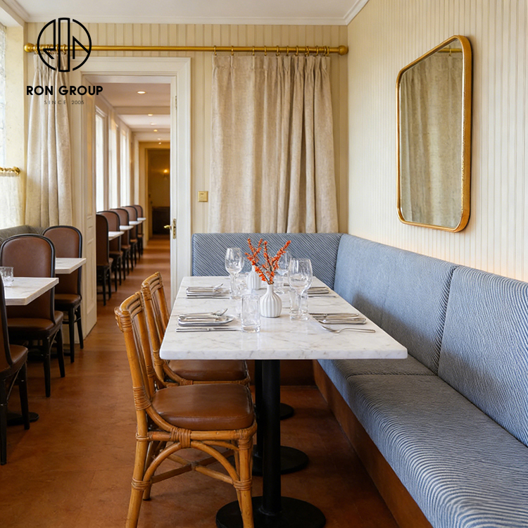 Custom Curved Booth Seating with Octagonal Stone Table for Space-Efficient Dining
