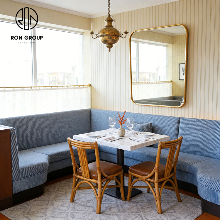 Custom Curved Booth Seating with Octagonal Stone Table for Space-Efficient Dining