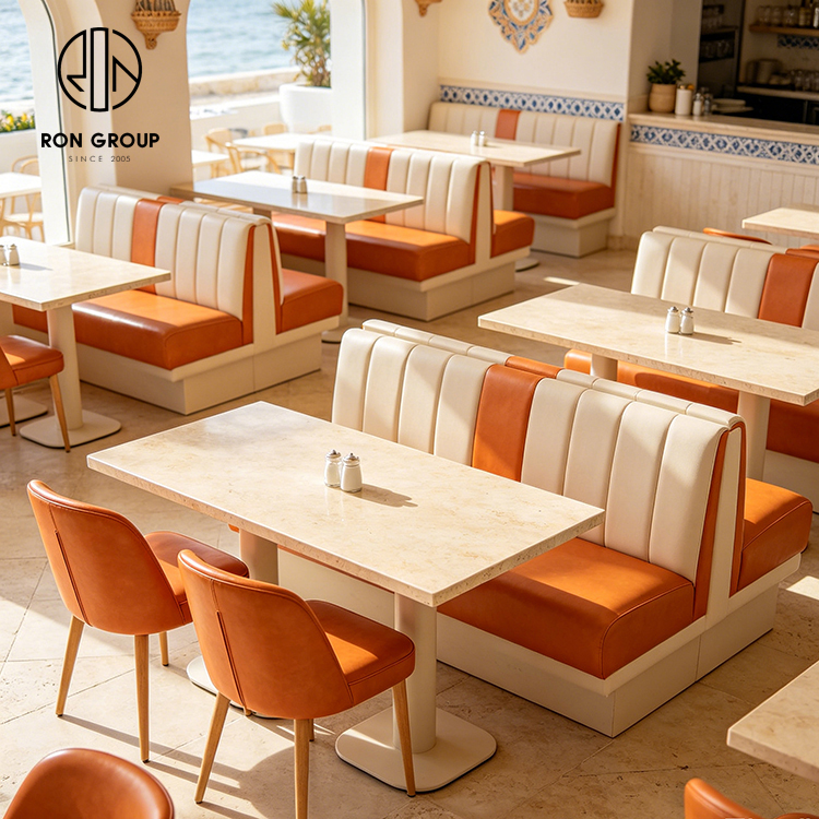 Modern Coastal Restaurant Furniture Set with Cream Leather Booth Seating, Square Terrazzo Tables and Orange Dining Chairs