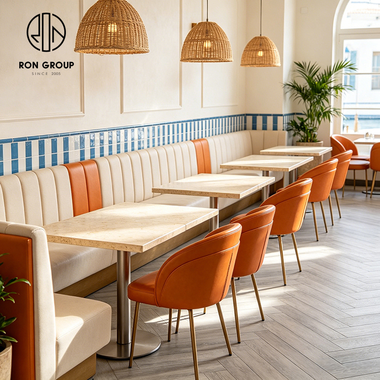 Modern Coastal Restaurant Furniture Set with Cream Leather Booth Seating, Square Terrazzo Tables and Orange Dining Chairs