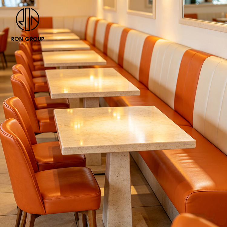 Modern Coastal Restaurant Furniture Set with Cream Leather Booth Seating, Square Terrazzo Tables and Orange Dining Chairs