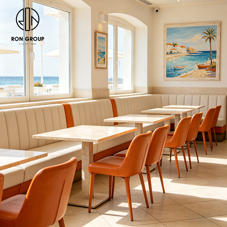 Modern Coastal Restaurant Furniture Set with Cream Leather Booth Seating, Square Terrazzo Tables and Orange Dining Chairs